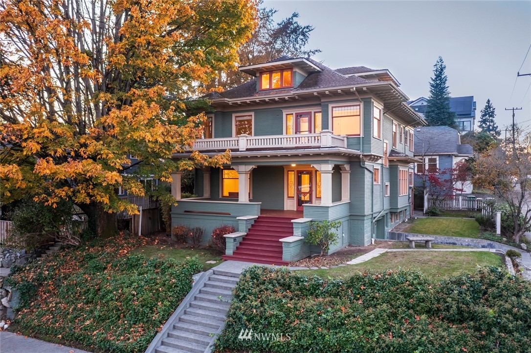4233 Meridian Avenue North Seattle, WA 98103 - Photo 1 of 40 a front view of a house with garden