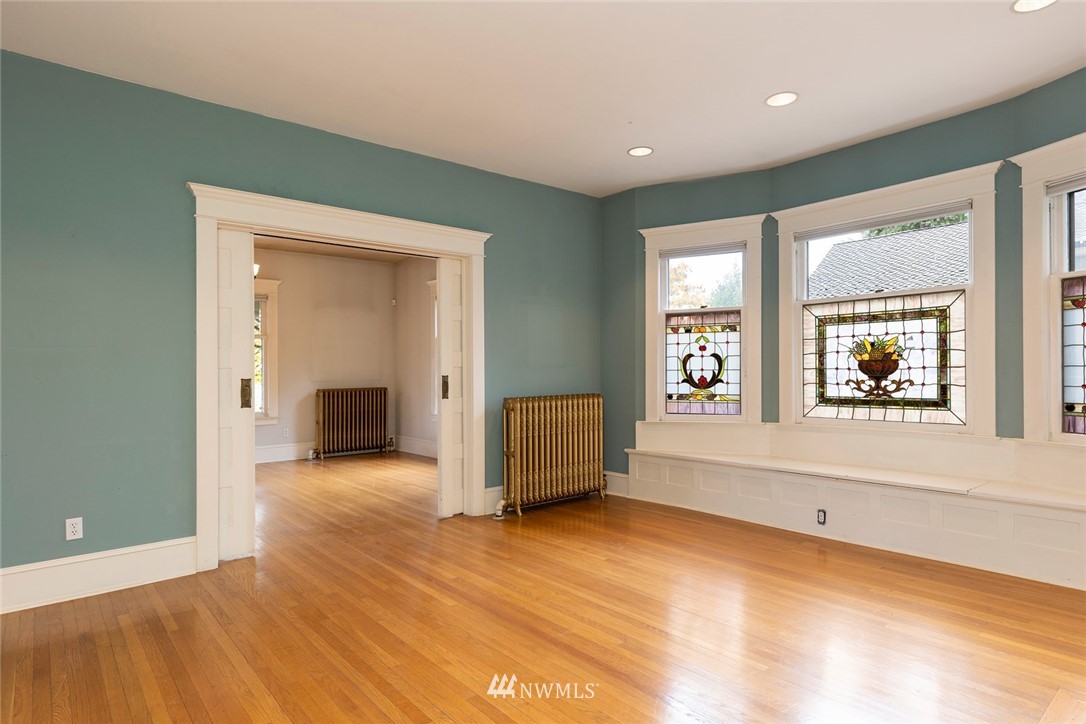 4233 Meridian Avenue North Seattle, WA 98103 - Photo 11 of 40 an empty room with a window and wooden floor