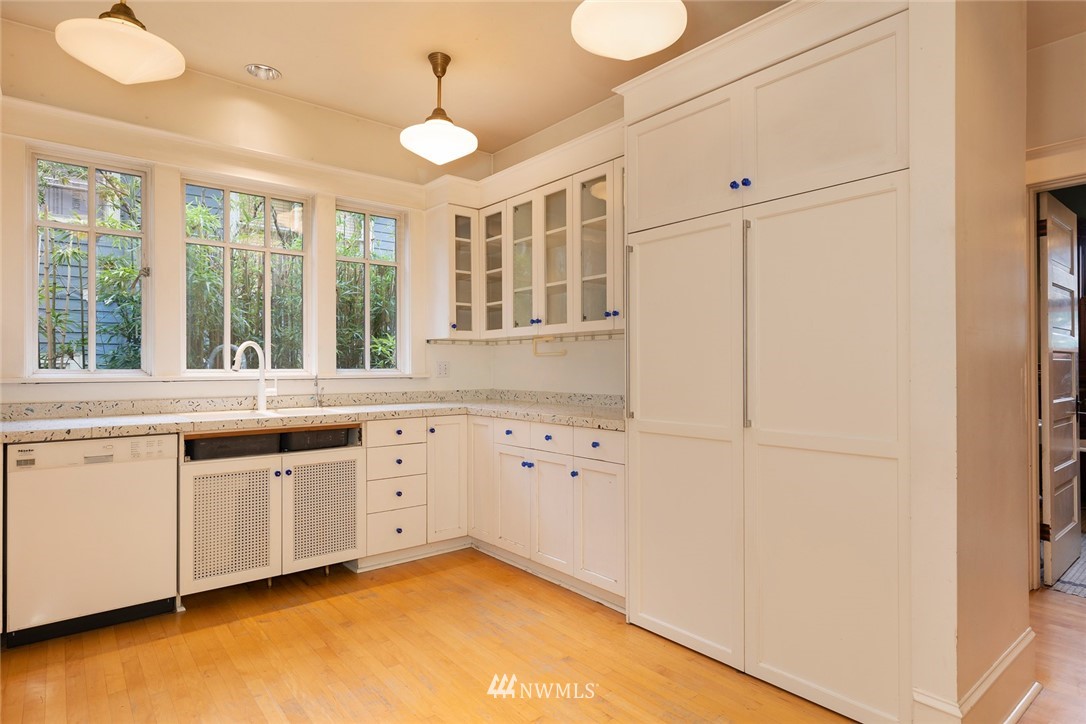 4233 Meridian Avenue North Seattle, WA 98103 - Photo 15 of 40 a large white kitchen with a large window