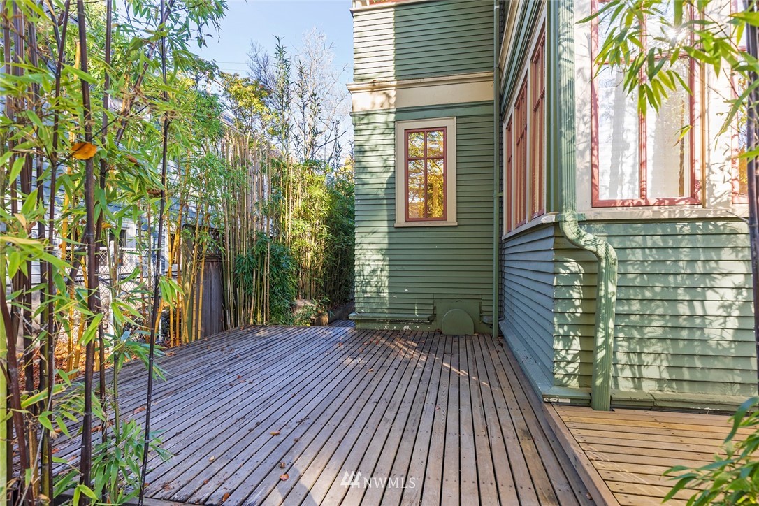 4233 Meridian Avenue North Seattle, WA 98103 - Photo 18 of 40 a view of backyard with a deck and wooden floor