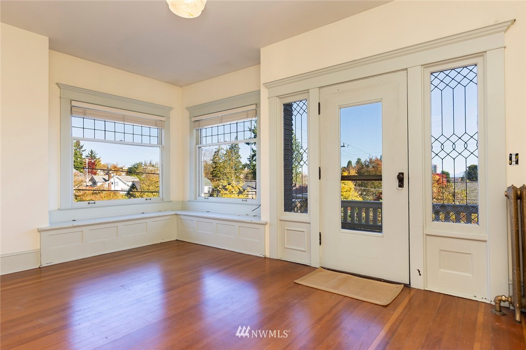 4233 Meridian Avenue North Seattle, WA 98103 - Photo 20 of 40 wooden floor in an empty room with a window