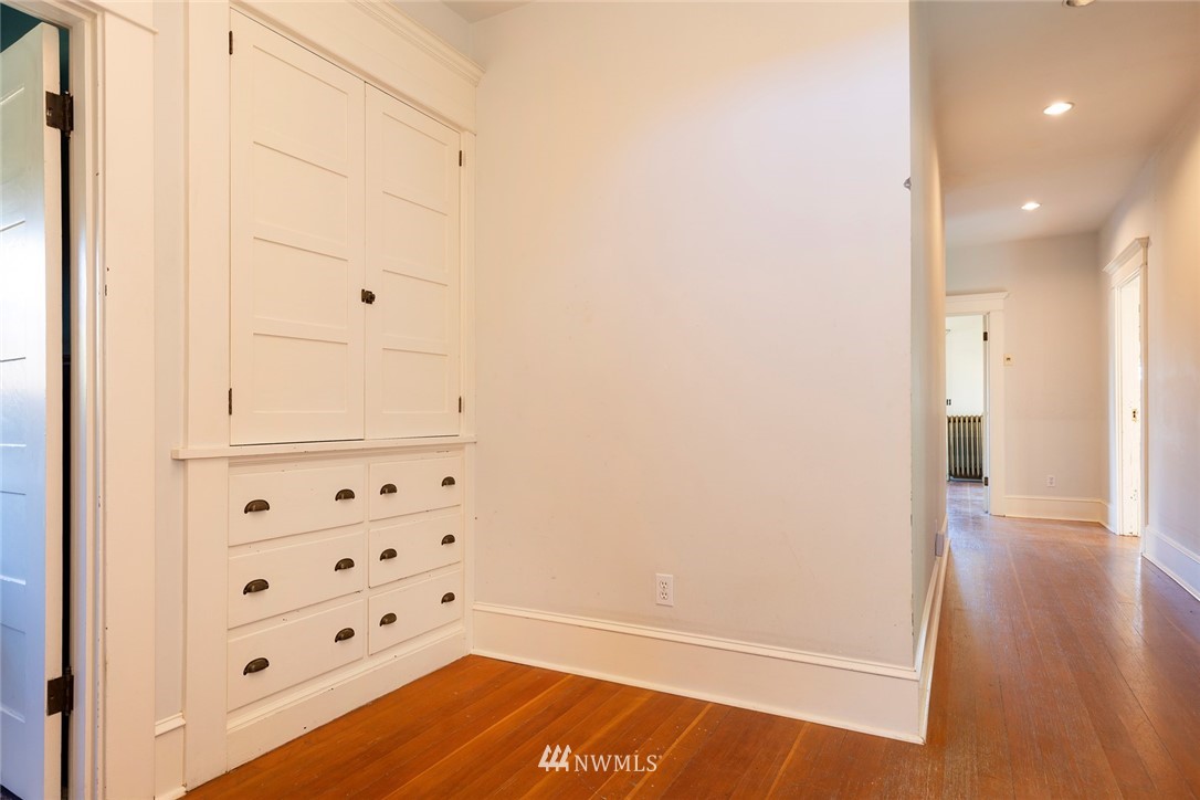 4233 Meridian Avenue North Seattle, WA 98103 - Photo 26 of 40 a view of hallway with wooden floor