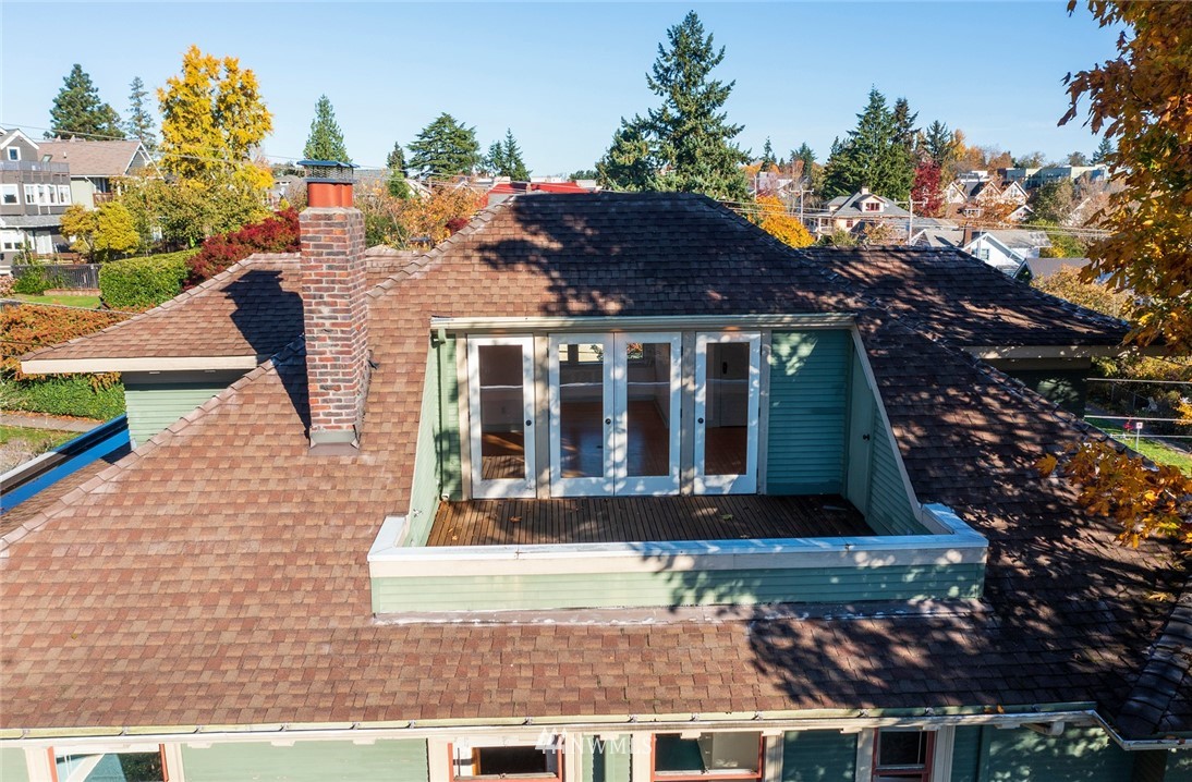 4233 Meridian Avenue North Seattle, WA 98103 - Photo 33 of 40 a view of house with outdoor space and sitting space