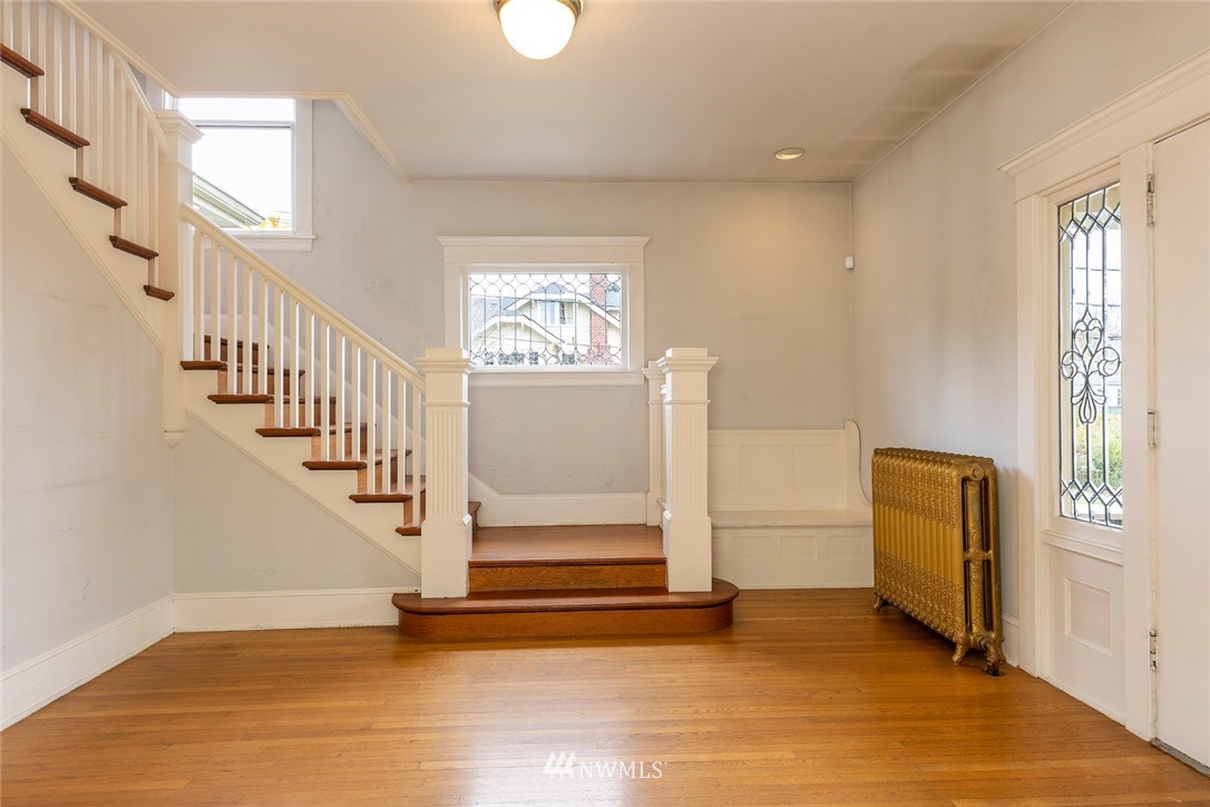 4233 Meridian Avenue North Seattle, WA 98103 - Photo 7 of 40 a view of entryway and hall with wooden floor