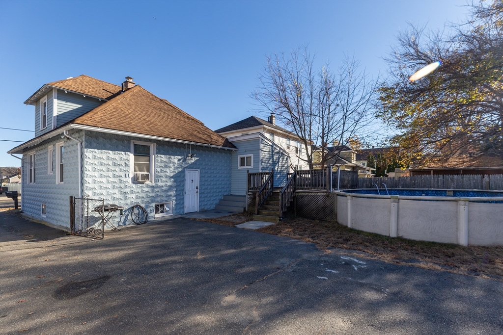 428 Page Boulevard Springfield, MA 01104 - Photo 6 of 40 a view of a house with a yard and large tree