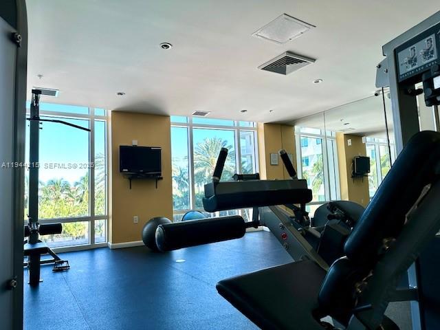 1755 East Hallandale Beach Boulevard, Unit 1605E Hallandale Beach, FL 33009 - Photo 4 of 12 a living room with furniture rug and a large window
