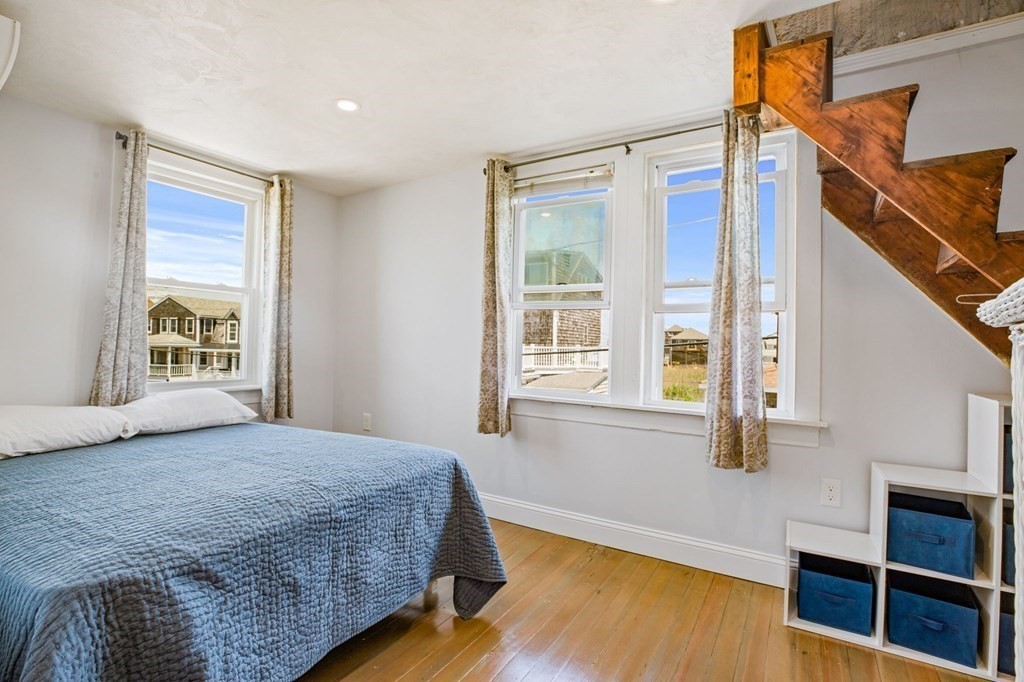 64 Lighthouse Road Scituate, MA 02066 - Photo 13 of 23 a bedroom with a bed and a window