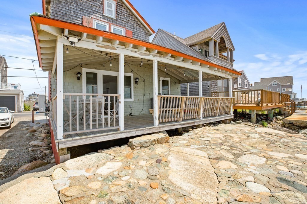 64 Lighthouse Road Scituate, MA 02066 - Photo 18 of 23 a backyard of a house with wooden fence