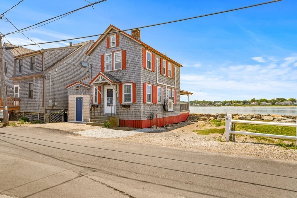 64 Lighthouse Road Scituate, MA 02066 - Photo 22 of 23 a view of a house with a ocean view