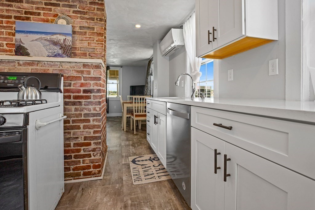 64 Lighthouse Road Scituate, MA 02066 - Photo 6 of 23 a kitchen with a sink and cabinets