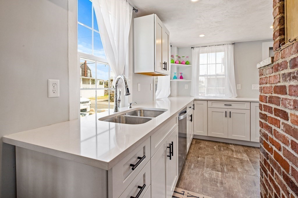 64 Lighthouse Road Scituate, MA 02066 - Photo 7 of 23 a kitchen that has a sink a stove and a window