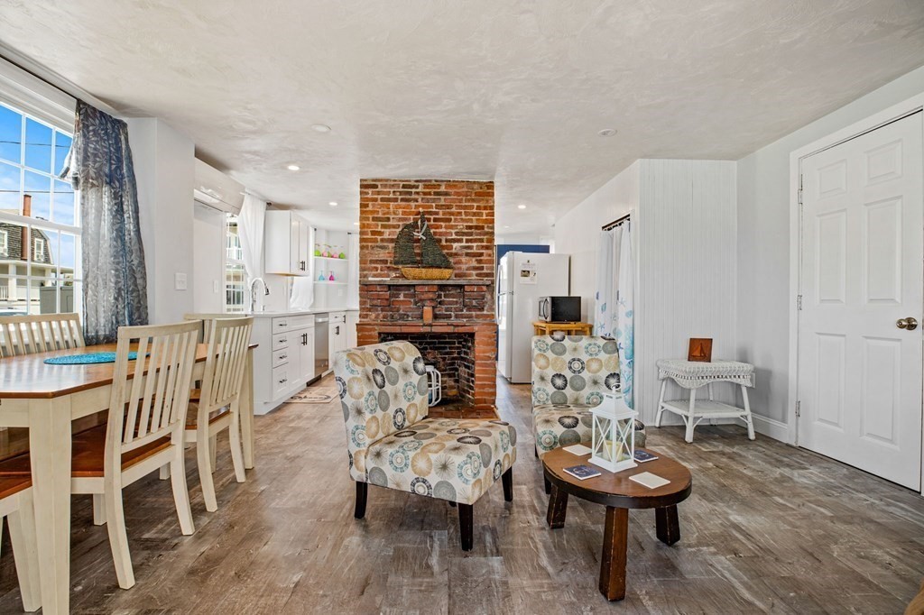 64 Lighthouse Road Scituate, MA 02066 - Photo 10 of 23 a living room with furniture and a wooden floor