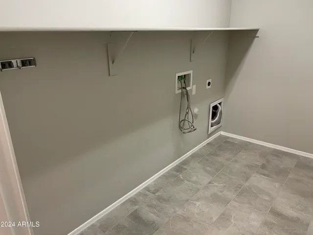 a view of storage and utility room with washer and dryer