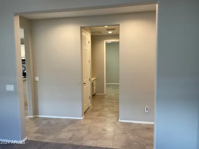 hallway view with wooden floor