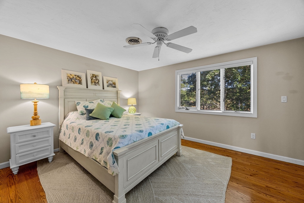381 Great Oak Road, Unit 9 Mashpee, MA 02649 - Photo 24 of 42 a bedroom with a bed and window