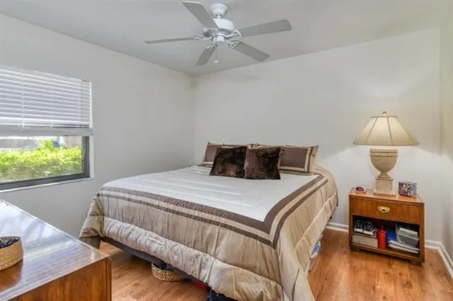 a bedroom with a bed and a table