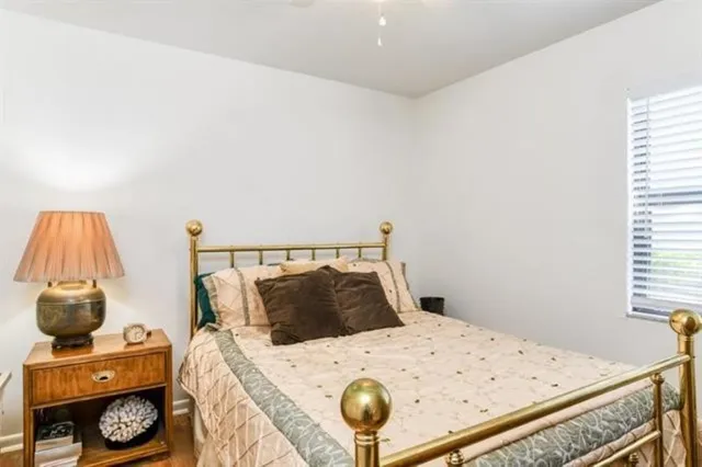 a bedroom with a bed and a table