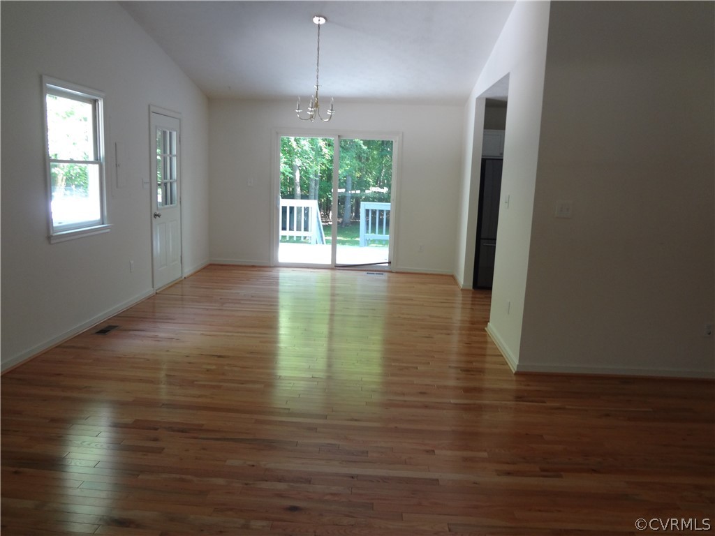 2518 Log Cabin Road Maidens, VA 23102 - Photo 8 of 20 a view of an empty room with wooden floor and a window