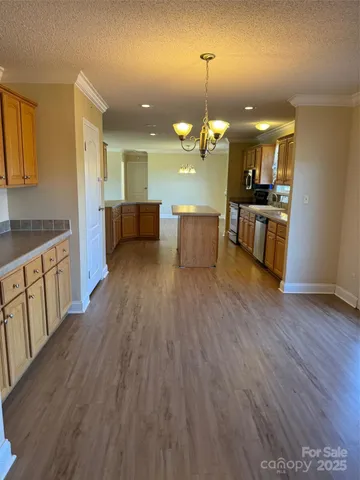 a view of kitchen with sink microwave and stove