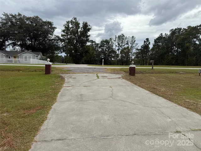 a view of a swimming pool with an outdoor seating and a garden