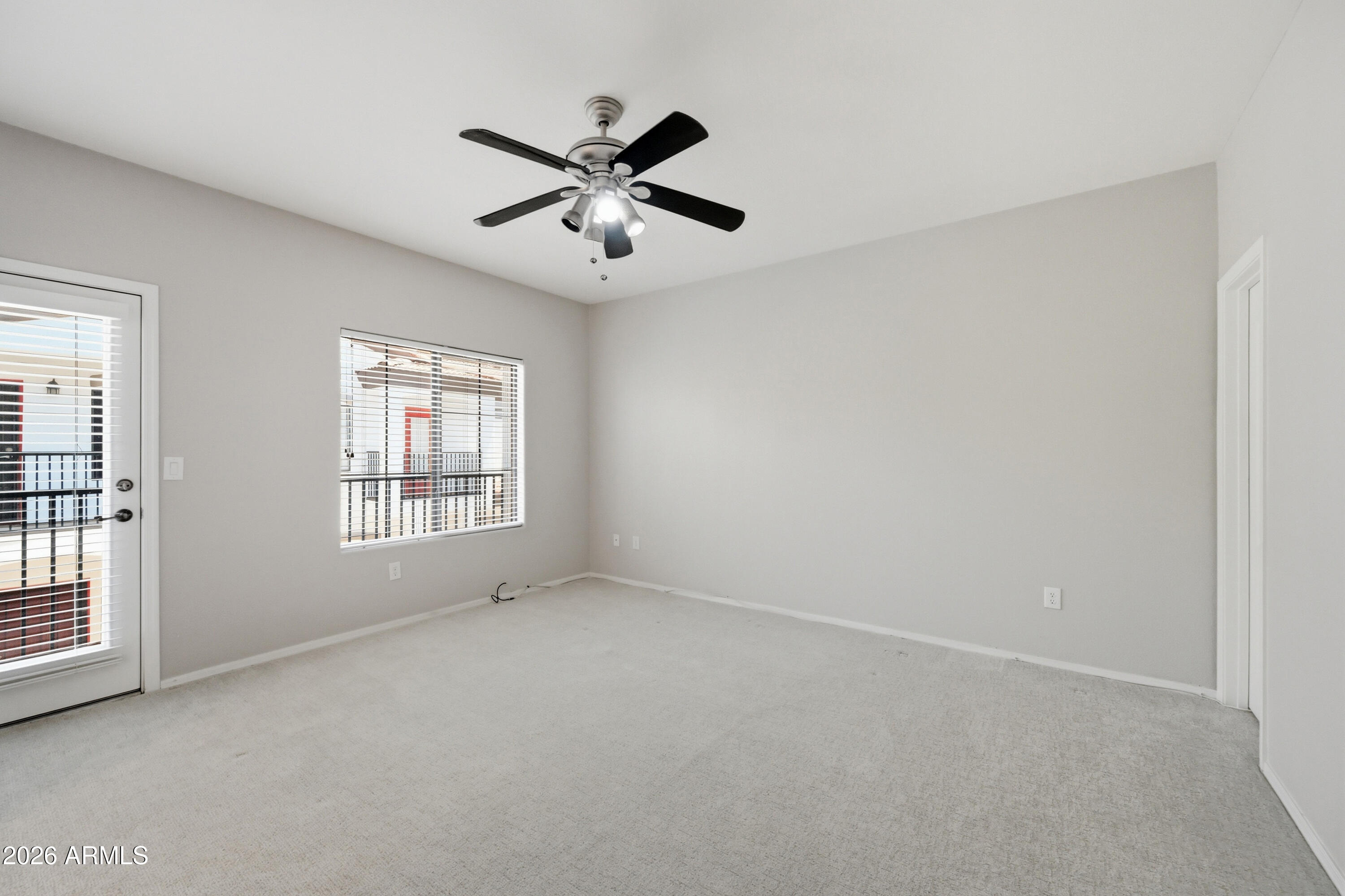 3150 East Beardsley Road, Unit 1009 Phoenix, AZ 85050 - Photo 16 of 31 a view of an empty room with a window