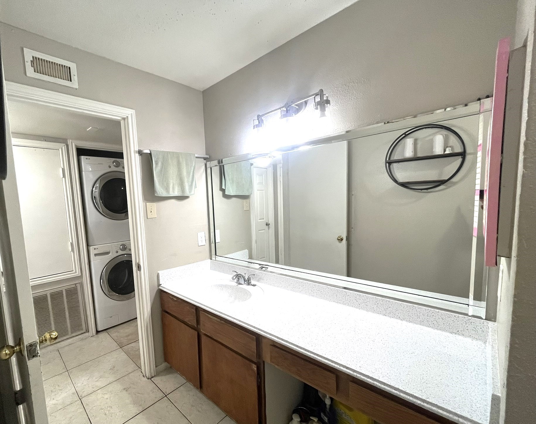 10211 Sugar Branch Drive, Unit 434 Houston, TX 77036 - Photo 11 of 13 a bathroom with a sink a mirror and shower