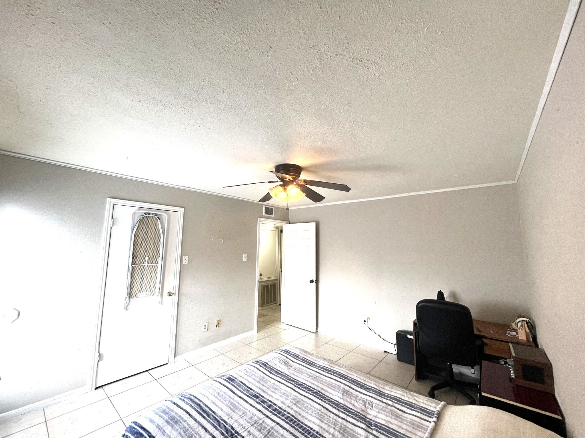 10211 Sugar Branch Drive, Unit 434 Houston, TX 77036 - Photo 13 of 13 a bedroom with a bed and wooden floor