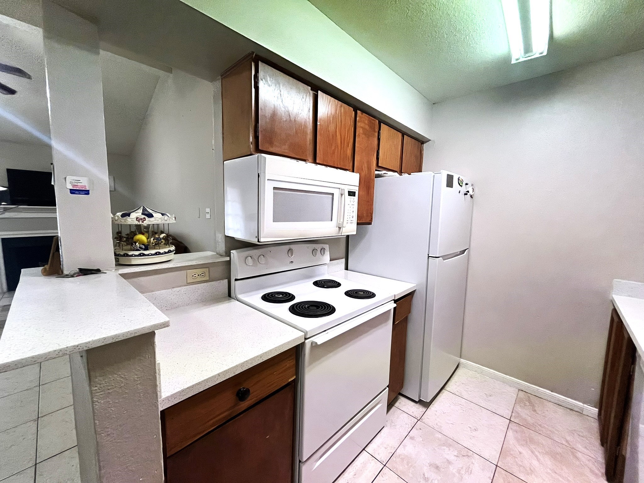 10211 Sugar Branch Drive, Unit 434 Houston, TX 77036 - Photo 8 of 13 a kitchen with stainless steel appliances a refrigerator sink and cabinets