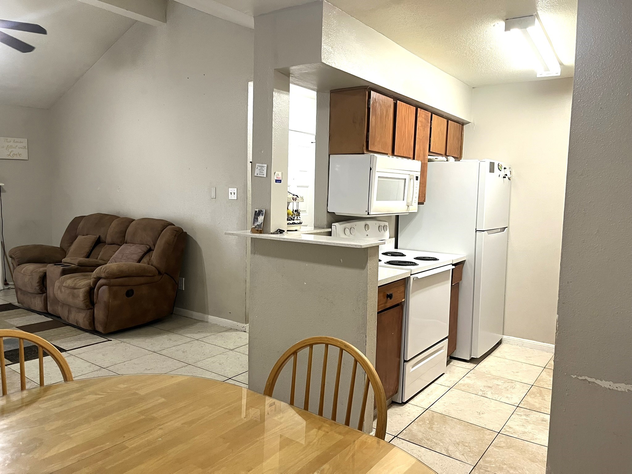10211 Sugar Branch Drive, Unit 434 Houston, TX 77036 - Photo 9 of 13 a kitchen with stainless steel appliances granite countertop a refrigerator and a stove top oven