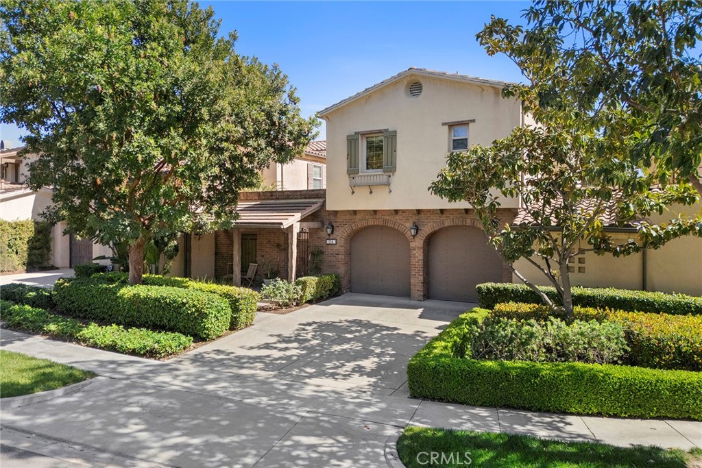 24 Tree Clover Irvine, CA 92618 - Photo 1 of 1 a front view of a house with a yard and garage