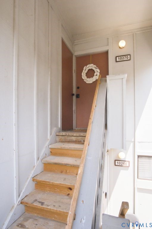 10270 Iron Mill Road Richmond, VA 23235 - Photo 3 of 29 Exterior staircase with wood steps, a gray painted