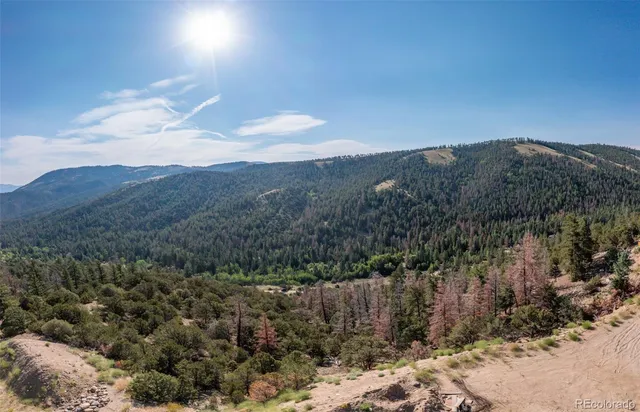 a view of a house with a mountain in the background