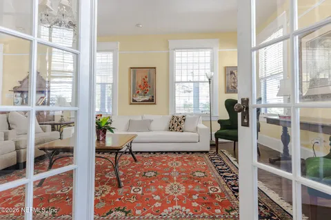 a kitchen with stainless steel appliances granite countertop a sink a stove and a wooden floors