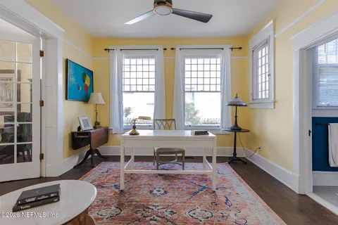 a view of a dining room with furniture and wooden floor