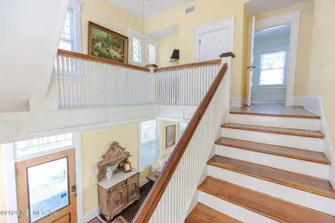 a view of staircase with white walls