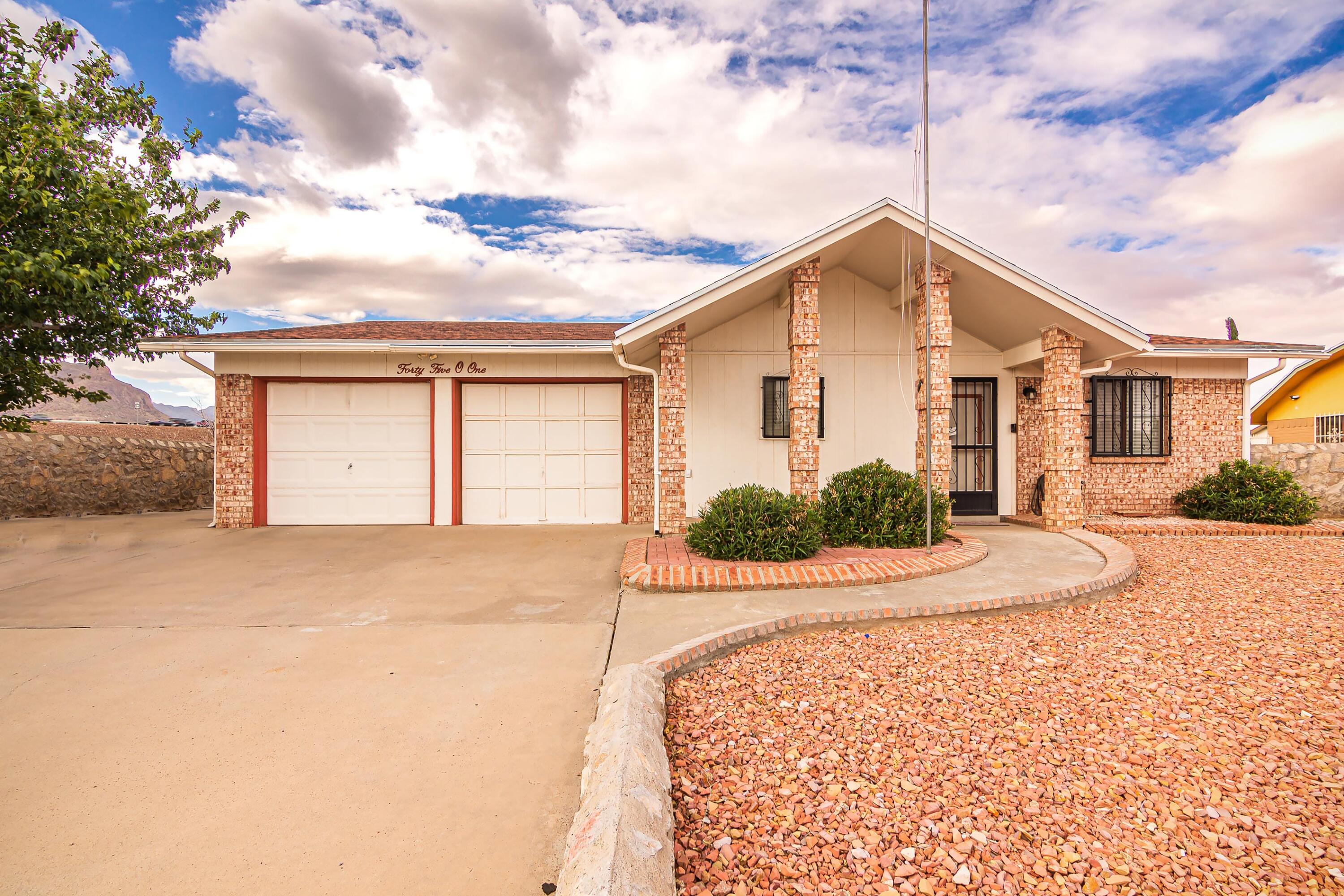4501 R T Cassidy Drive El Paso, TX 79924 - Photo 1 of 1 a front view of a house with a yard and garage