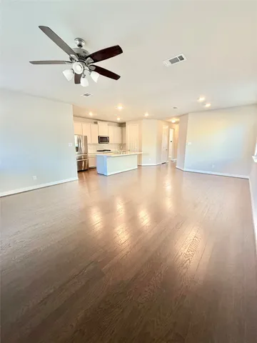 a view of a kitchen with a sink and a window