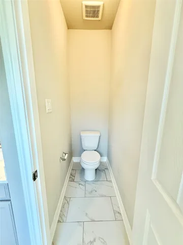 a bathroom with a toilet