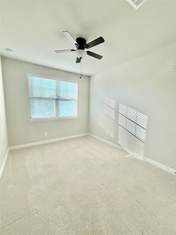 an empty room with a empty space and windows