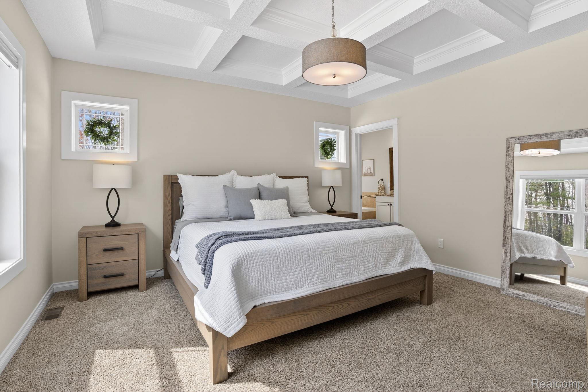 101 Highview Road Traverse City, MI 49696 - Photo 38 of 88 Carpeted bedroom featuring multiple windows and coffered ceiling