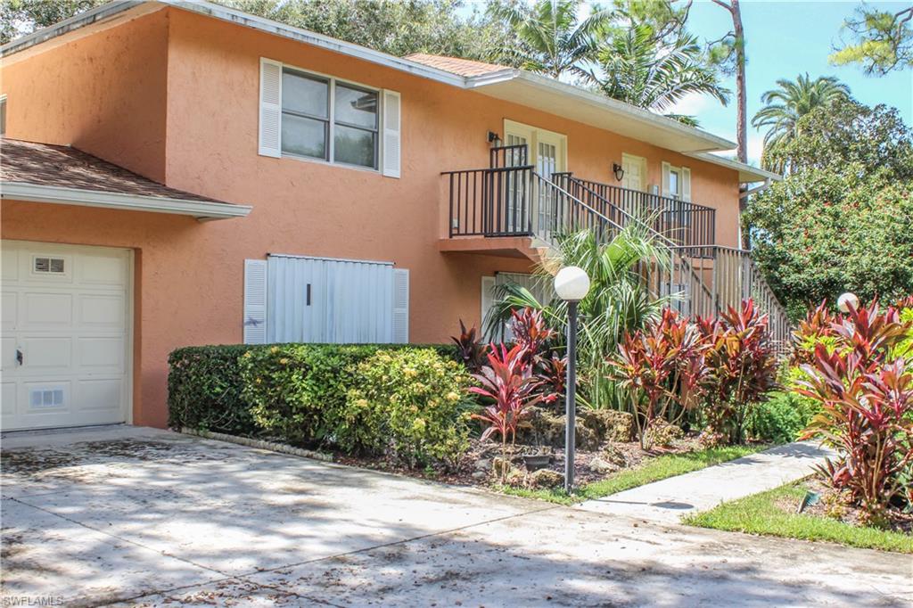197 Albi Road, Unit 202 Naples, FL 34112 - Photo 2 of 12 a front view of a house