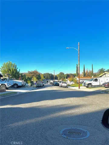 a view of a street with a building in the background