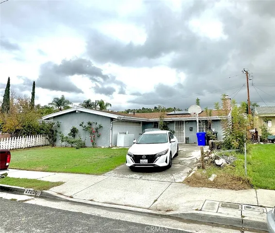 a car parked in front of a house