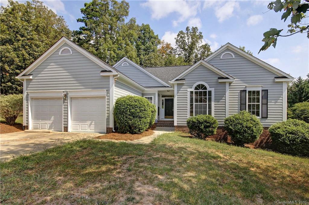 11931 Harris Ridge Drive Charlotte, NC 28269 - Photo 1 of 19 a view of a house with a yard and potted plants