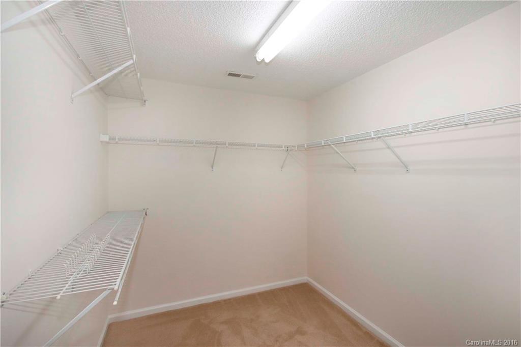 11931 Harris Ridge Drive Charlotte, NC 28269 - Photo 12 of 19 a view of a room with racks on the wall