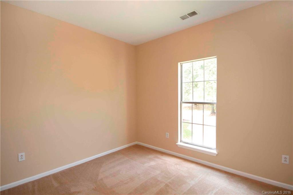 11931 Harris Ridge Drive Charlotte, NC 28269 - Photo 13 of 19 an empty room with a window