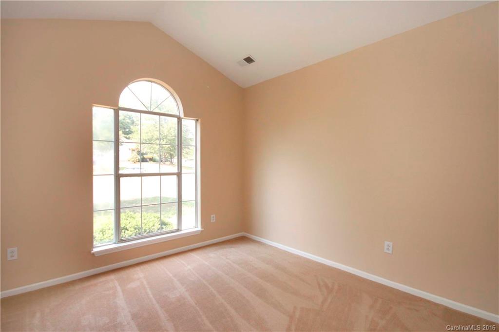 11931 Harris Ridge Drive Charlotte, NC 28269 - Photo 15 of 19 an empty room with windows and closet