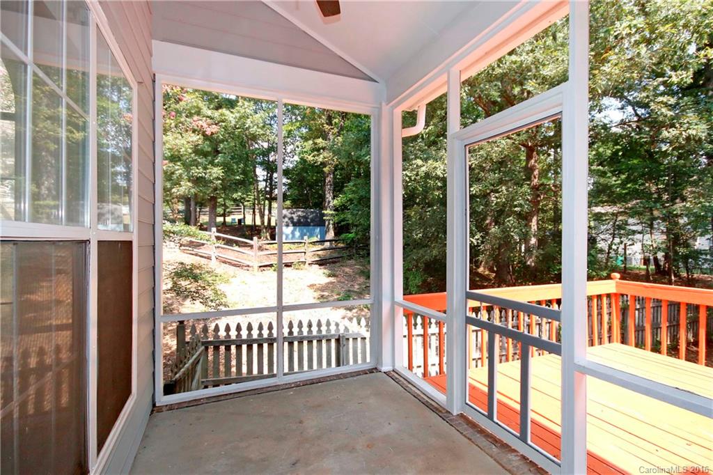 11931 Harris Ridge Drive Charlotte, NC 28269 - Photo 16 of 19 a view of a porch with a floor to ceiling window