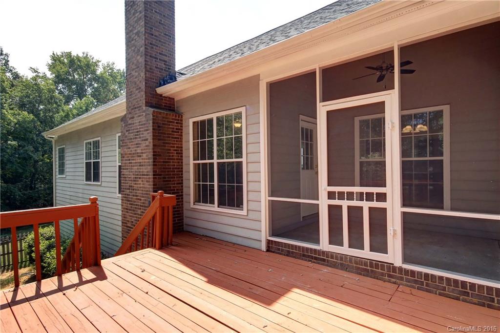 11931 Harris Ridge Drive Charlotte, NC 28269 - Photo 17 of 19 a view of a deck with wooden floor and floor to ceiling window