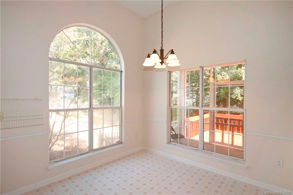11931 Harris Ridge Drive Charlotte, NC 28269 - Photo 8 of 19 a view of an empty room with a window